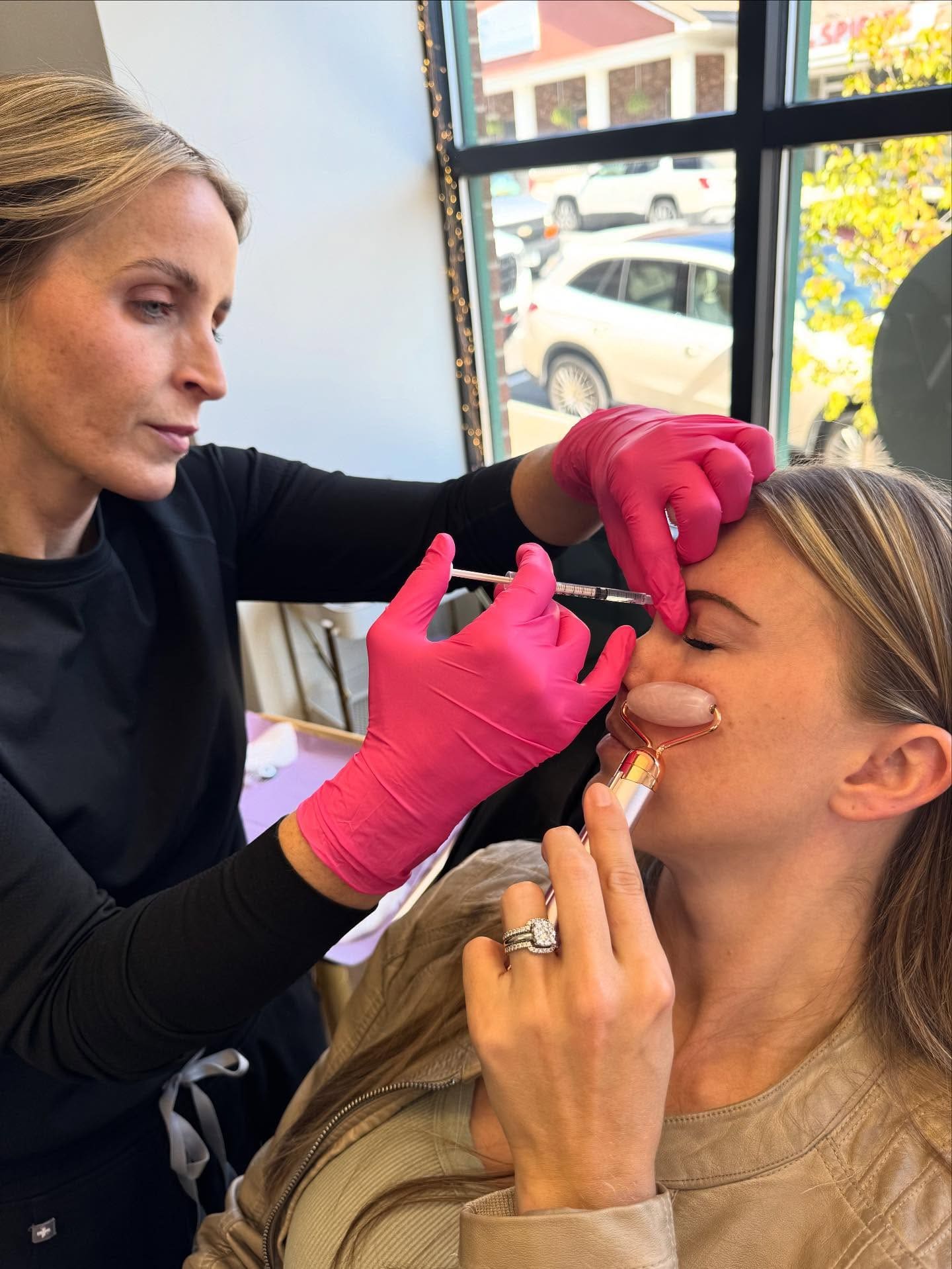 Brandy injects a client's brow